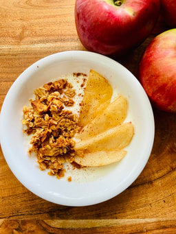 Sweet Babu's small-batch granola on yogurt with apples